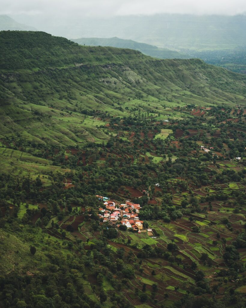 an aerial view of a village in the mountains